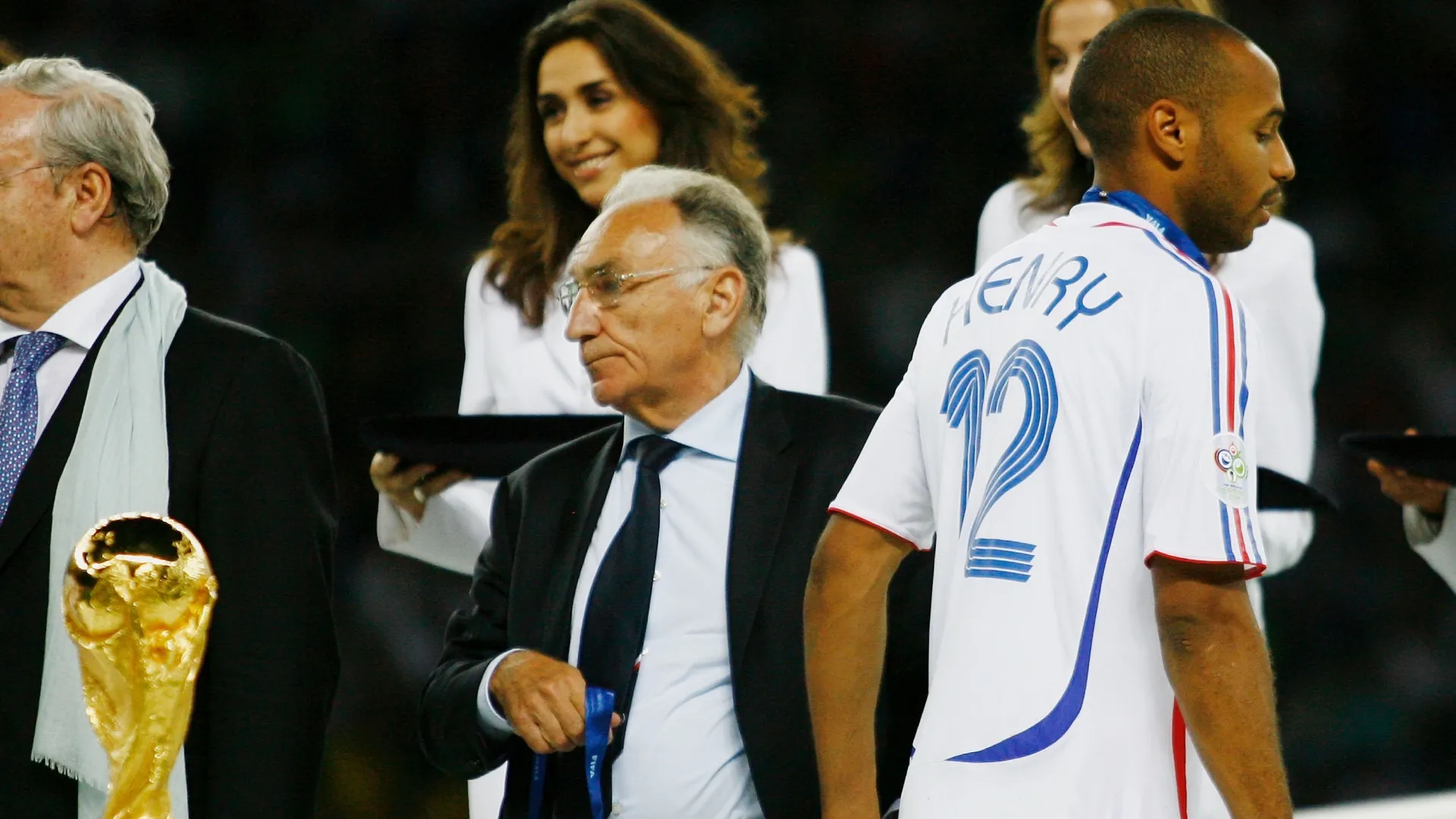 Thierry Henry of France walks past the World Cup trophy following his team's defeat at the end of the 2006 World Cup.