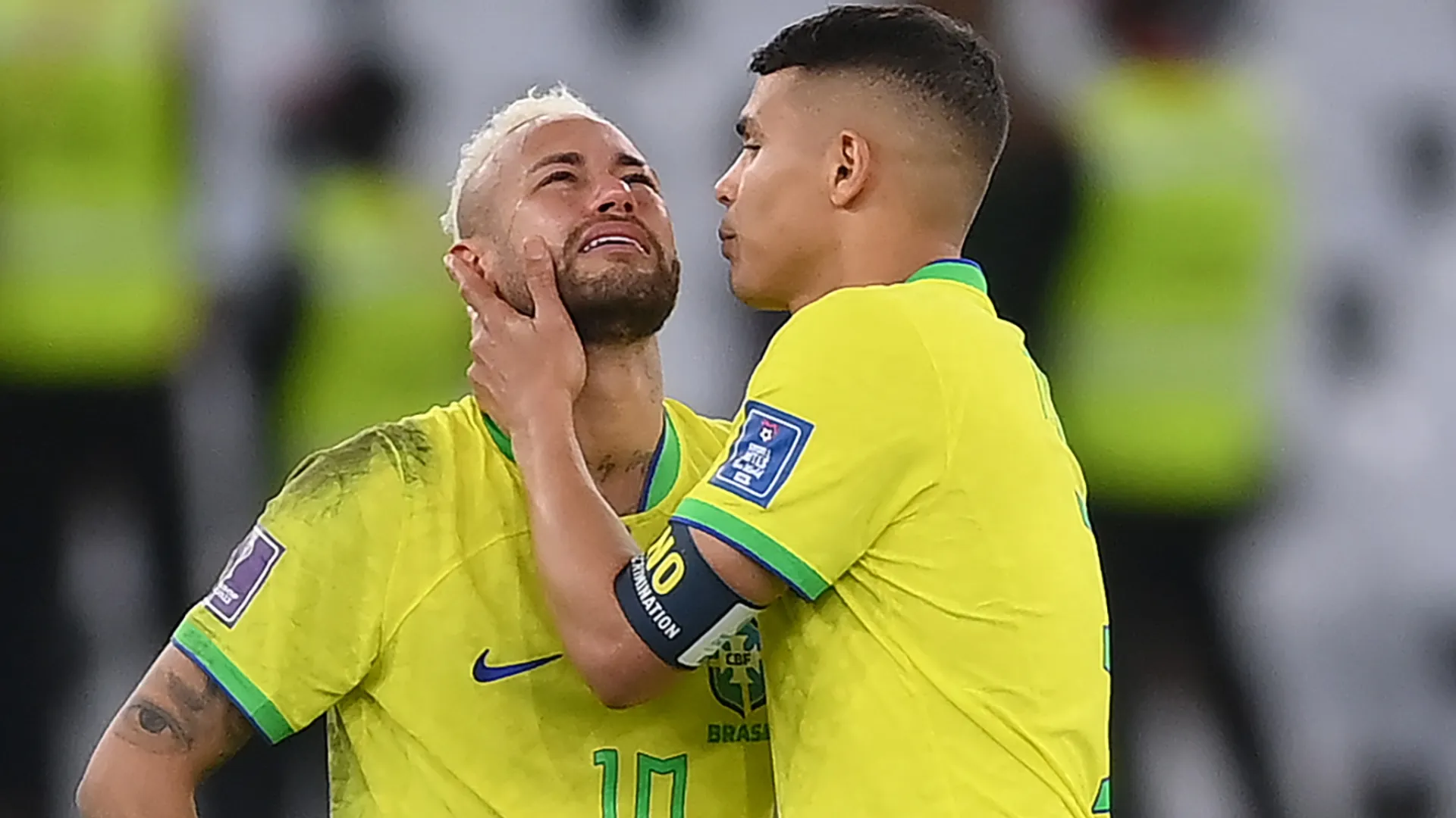 Neymar of Brazil is consoled by Thiago Silva.