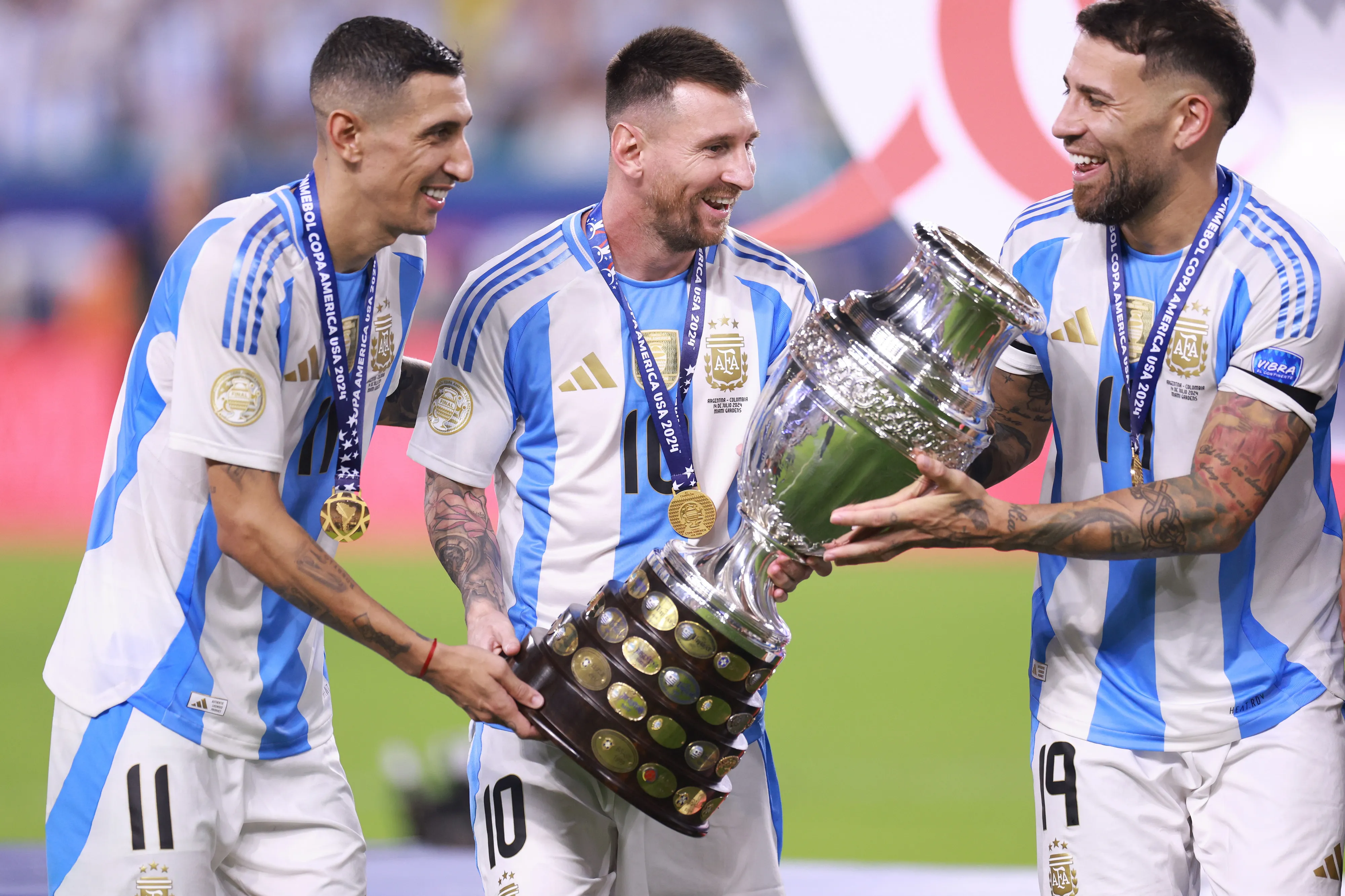 MIAMI GAAngel Di Maria, Lionel Messi and Nicolas Otamendi of Argentina celebrate with the trophy after the team’s victory in the CONMEBOL Copa America 2024 Final