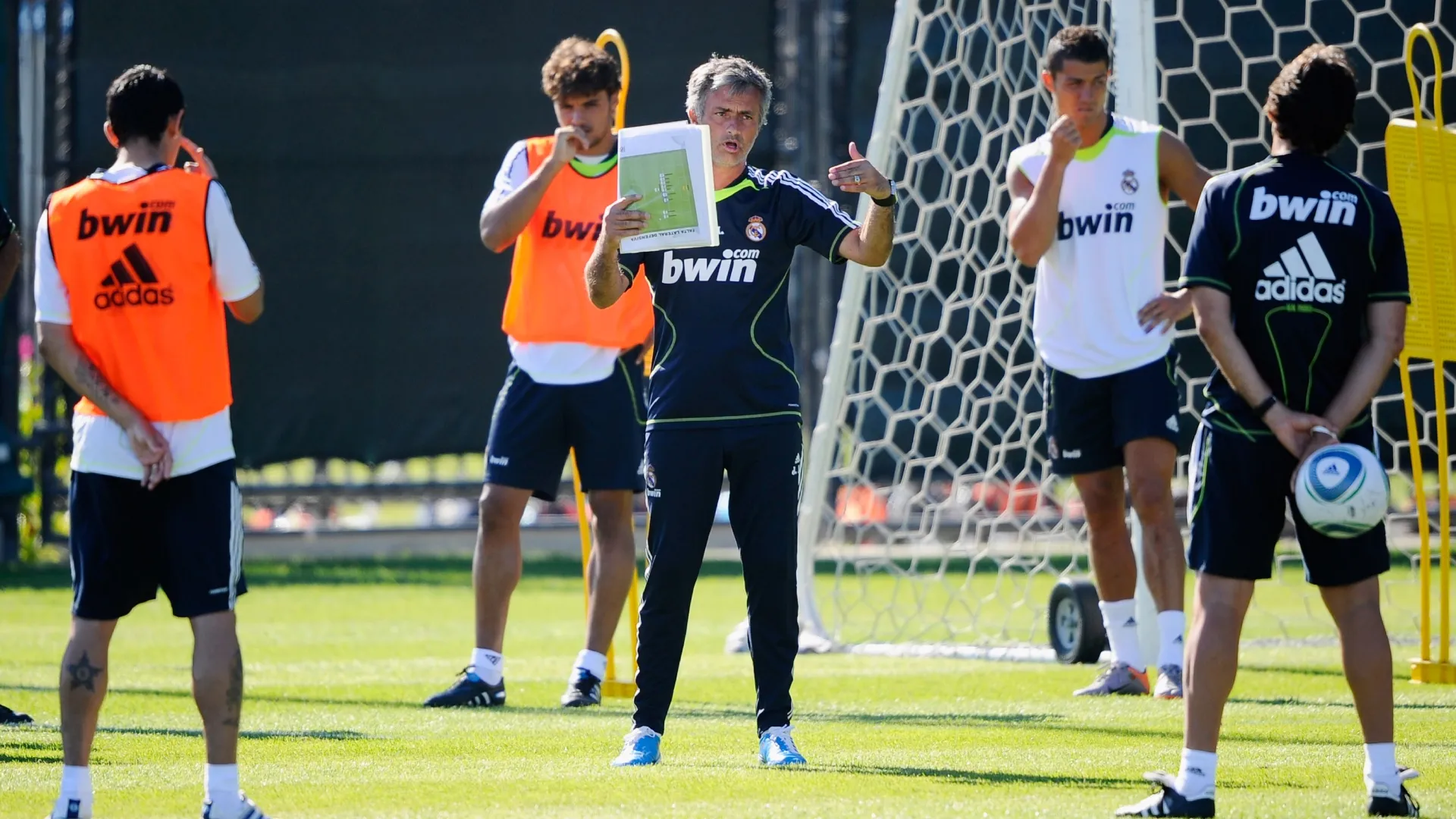 Coach Jose Mourinho (C) of Real Madrid instructs his players during a training session.