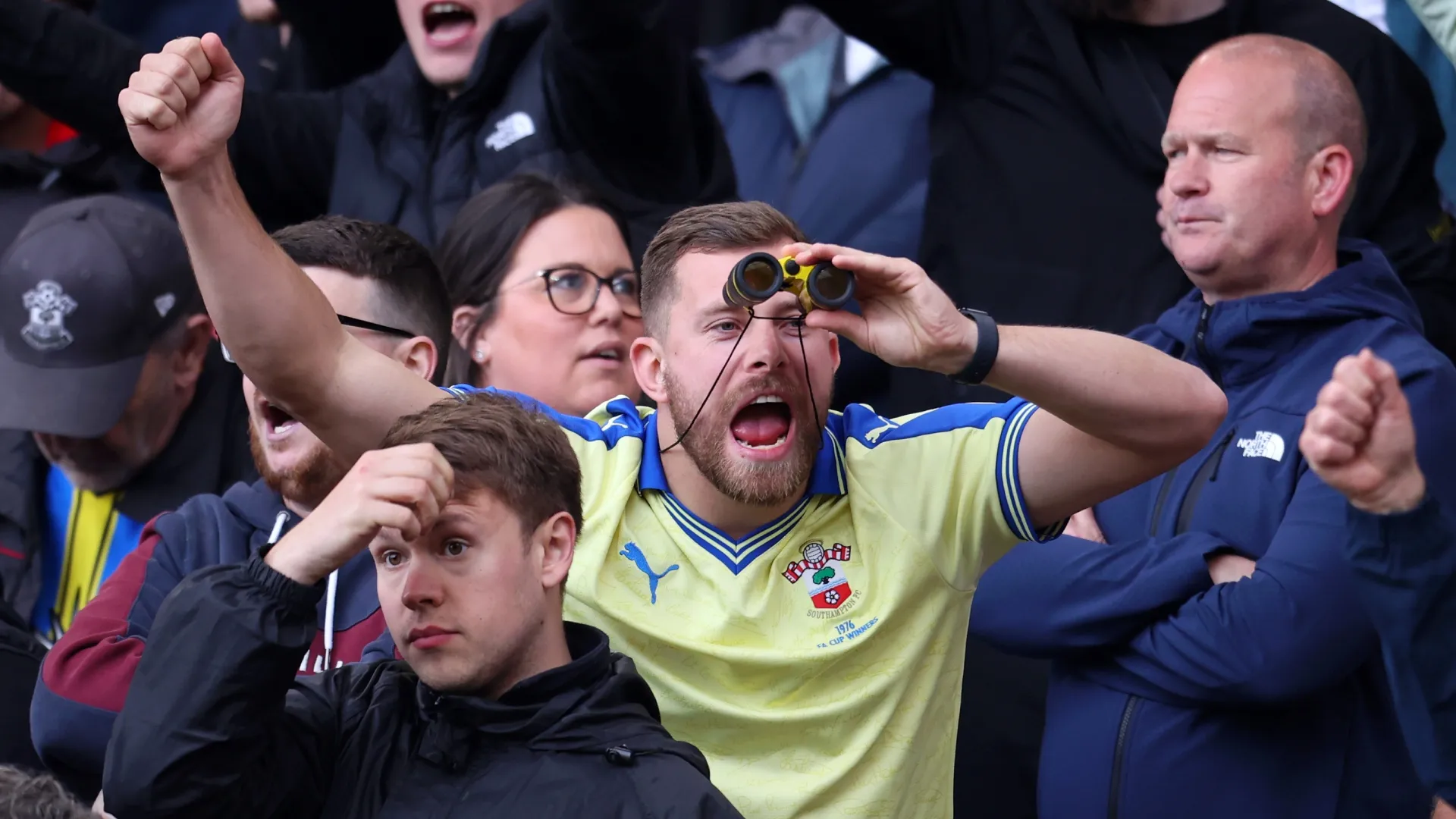 A Southampton fan uses binoculars during the game against Middlesbrough.