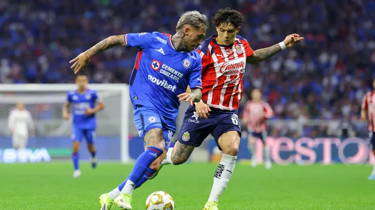 Sergio Aguayo of Chivas fights for the ball with Gonzalo Piovi of Cruz Azul