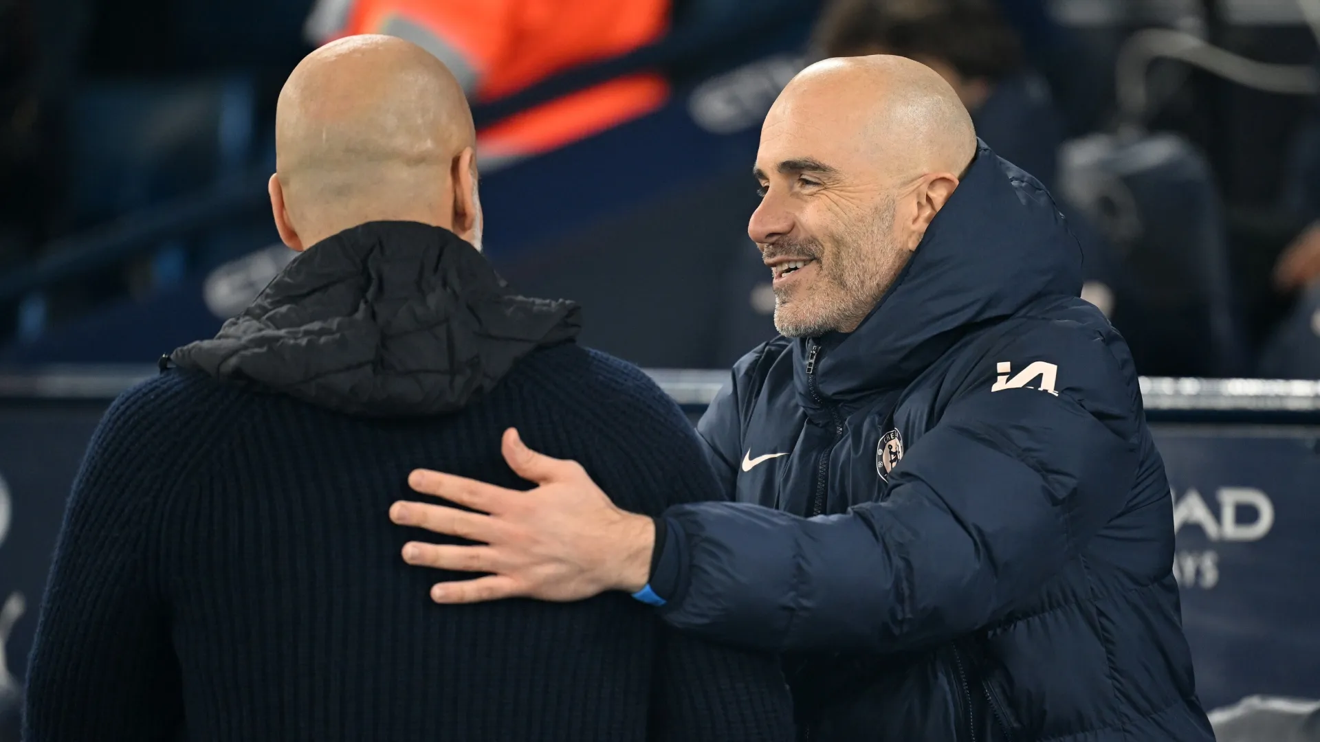 Enzo Maresca, coach of Chelsea, embraces Pep Guardiola, coach of Manchester City.