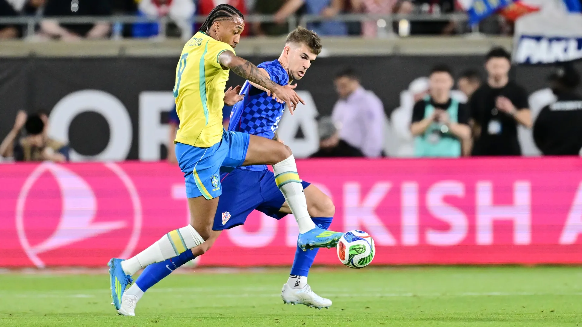 Joao Pedro of Brazil and Luka Vuskovic of Croatia battle for possession.