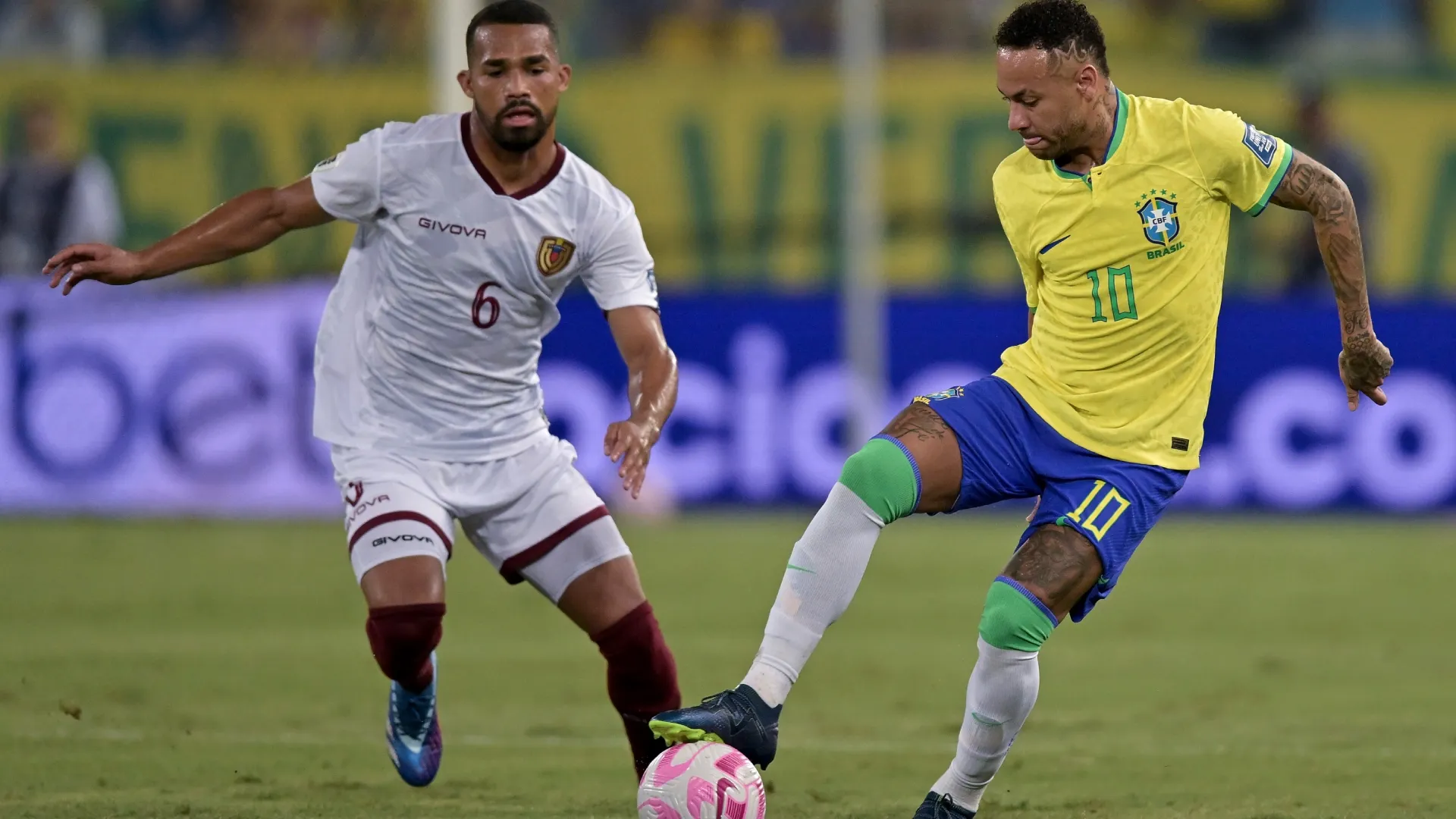 Neymar Jr. of Brazil battles for possession with Yangel Herrera of Venezuela during a FIFA World Cup 2026 Qualifier match.