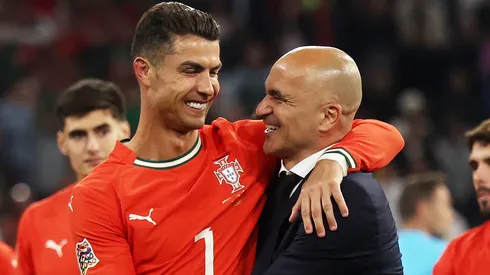 Cristiano Ronaldo of Portugal celebrates victory with Roberto Martinez, Manager of Portugal.