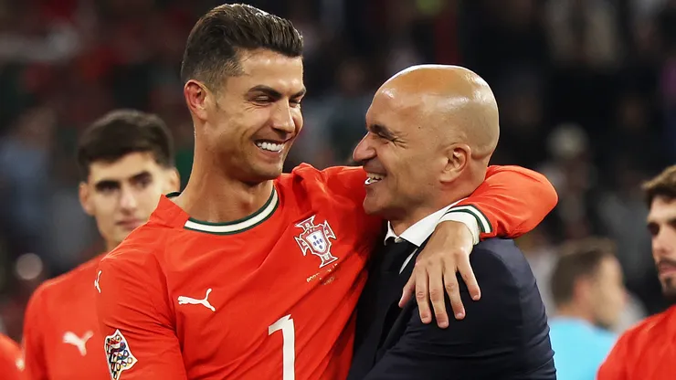 Cristiano Ronaldo of Portugal celebrates victory with Roberto Martinez, Manager of Portugal.