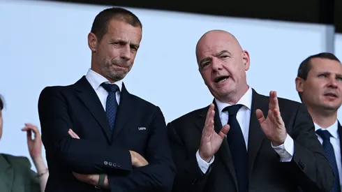 Aleksander Ceferin, President of UEFA, (L) speaks with Gianni Infantino, President of FIFA (R).