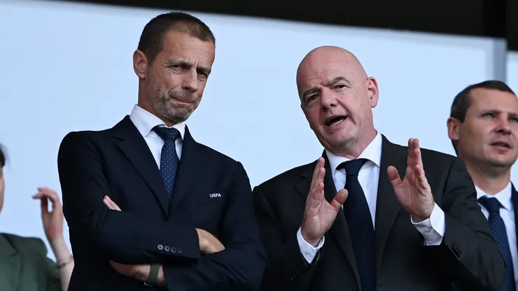 Aleksander Ceferin, President of UEFA, (L) speaks with Gianni Infantino, President of FIFA (R).
