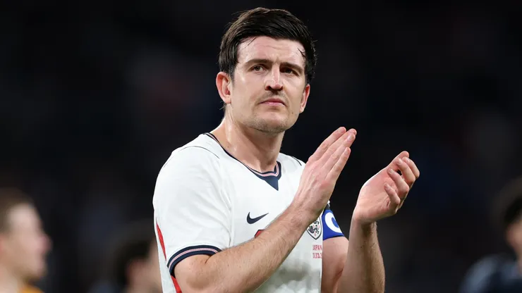 Harry Maguire of England applauds the fans.