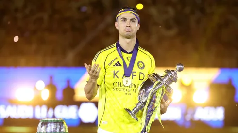 Cristiano Ronaldo of Al Nassr celebrates with the Saudi Pro League Trophy.
