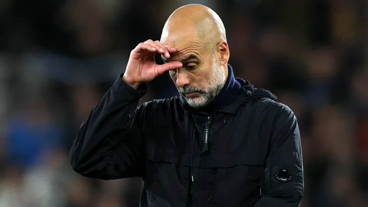 Pep Guardiola, Manager of Manchester City, appears dejected