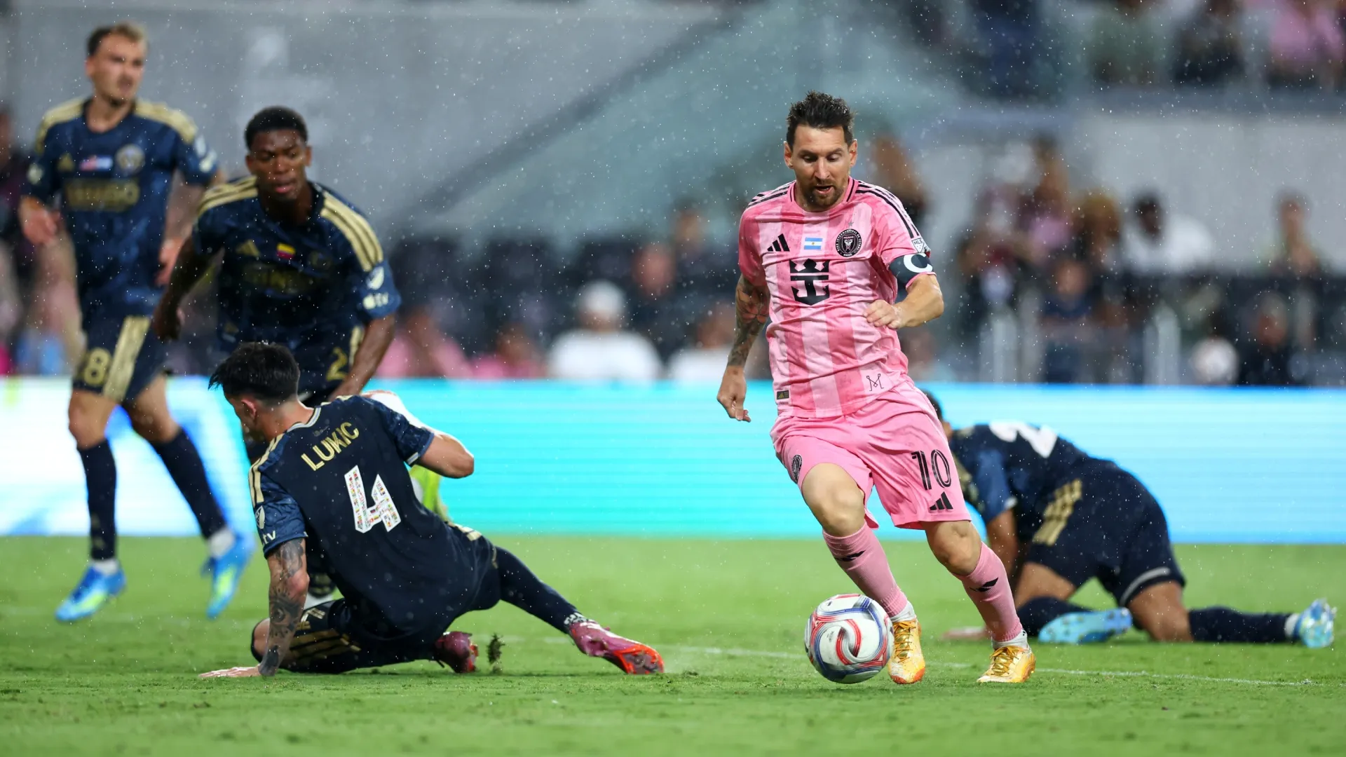 Lionel Messi #10 of Inter Miami CF runs with the ball against Jovan Lukic #4 of Philadelphia Union.