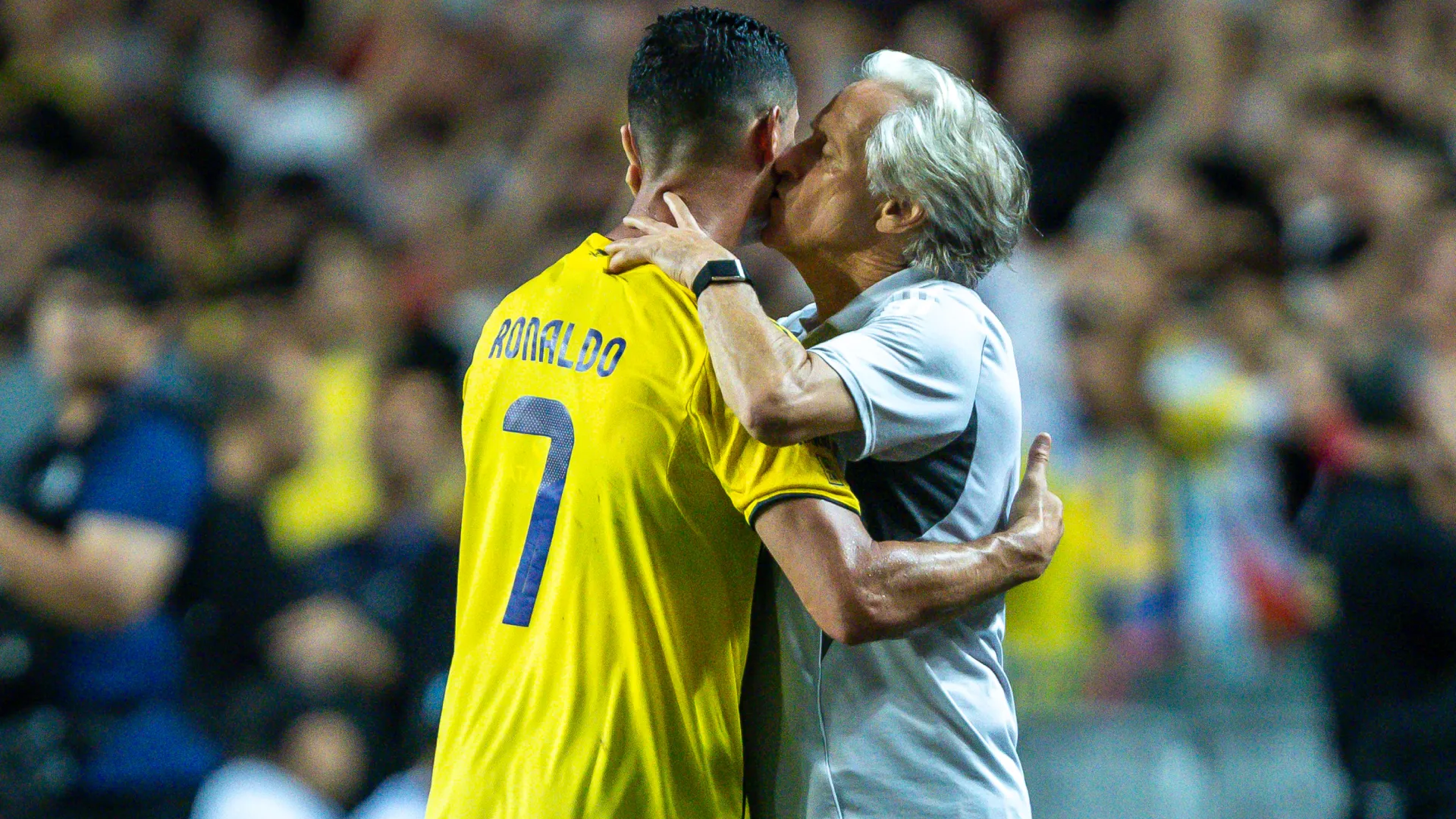 Jorge Jesus kisses Cristiano Ronaldo on the cheek. (Getty Images)