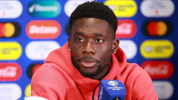 Alphonso Davies of Canada speaks during a press conference.