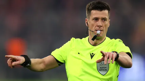 Referee Benoit Bastien gestures following a VAR review.