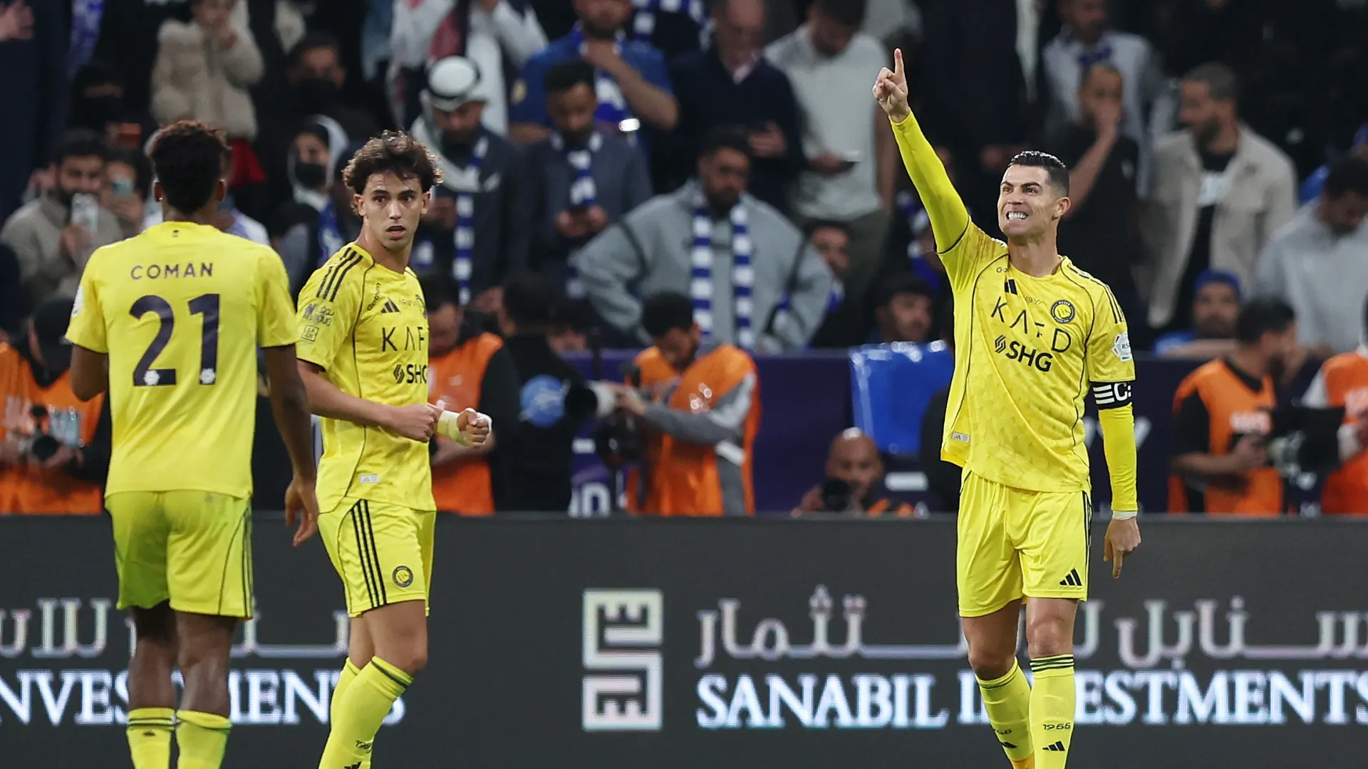 Cristiano Ronaldo of Al-Nassr celebrates with teammates Joao Felix and Kingsley Coman after scoring.