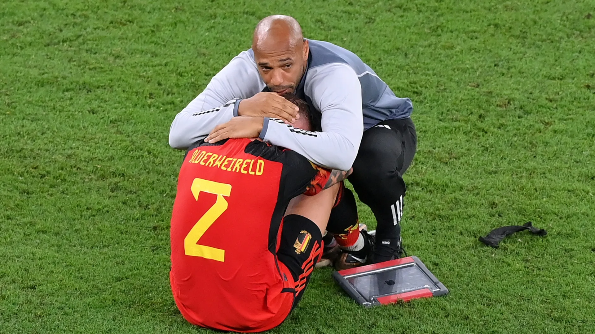 Thierry Henry, Assistant Coach of Belgium consoles Toby Alderweireld after 2022 World Cup elimination.