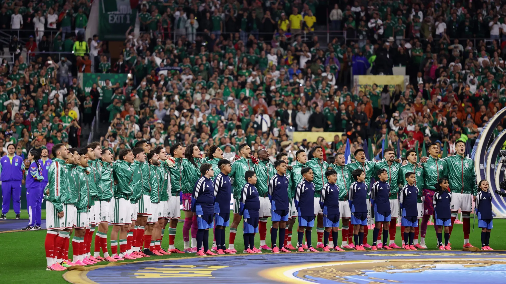 Players of Mexico line up prior to the Ecuador game.