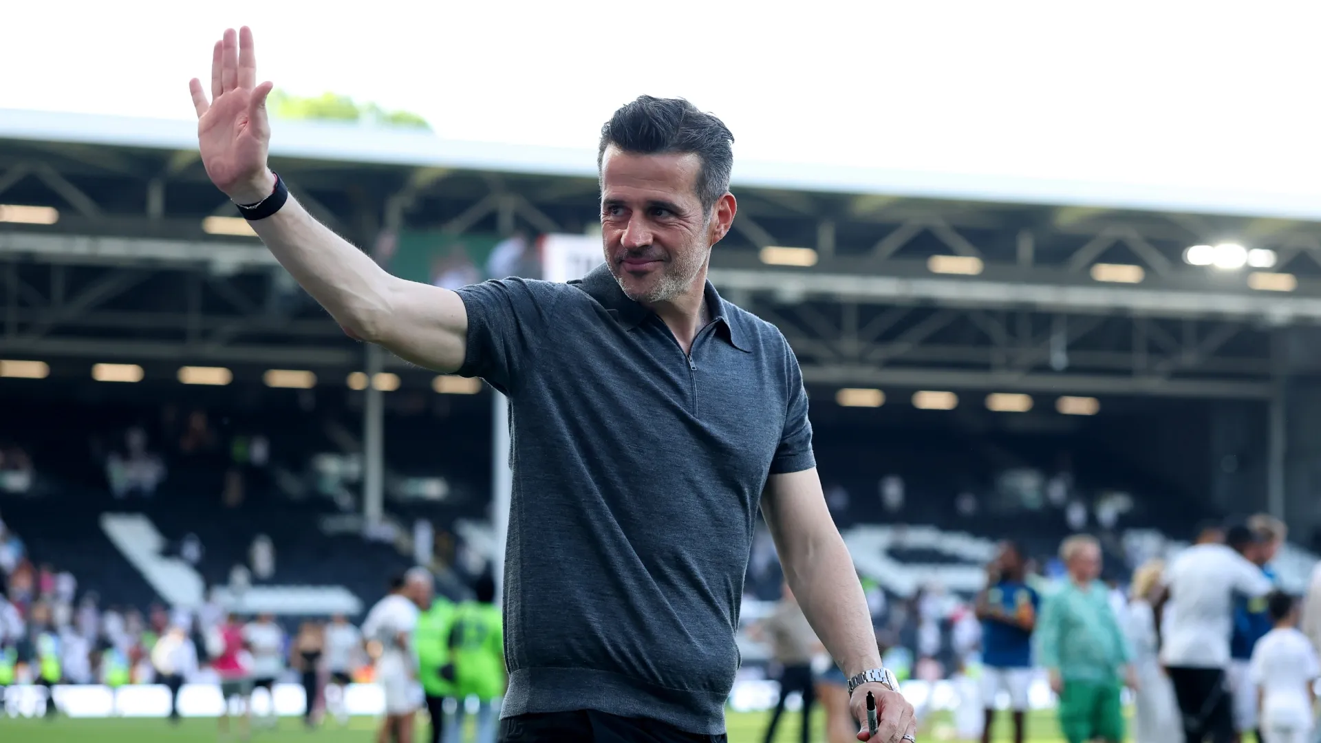 Fulham head coach, Marco Silva waves at the fans.