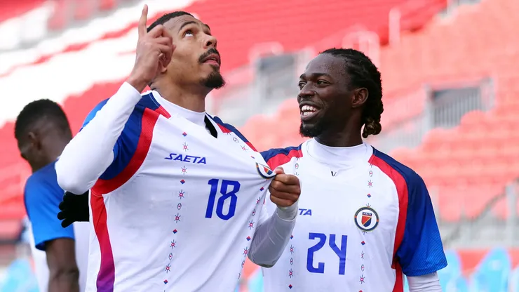 Wilson Isidor #18 of Haiti celebrates with Oliver Pierre Woodensky #24