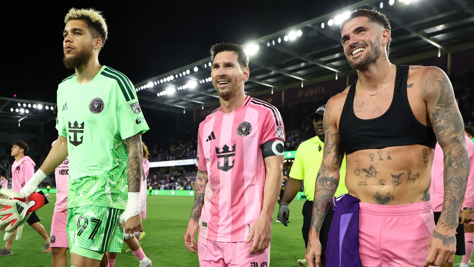 Lionel Messi #10 of Inter Miami CF reacts with teammates Dayne St. Clair #97 and Rodrigo De Paul #7.