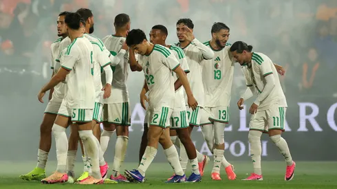 Anis Hadj Moussa of Algeria celebrates scoring against the Netherlands.