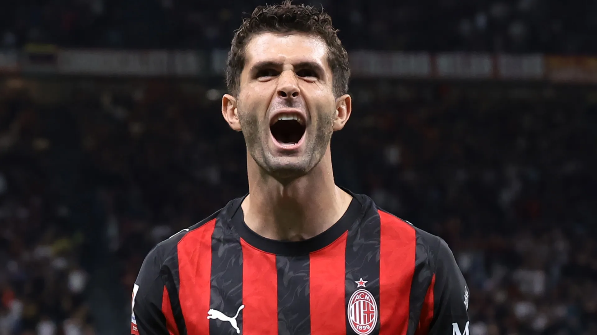 Christian Pulisic of AC Milan celebrates after scoring a goal.