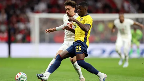 Neil Al Aynaooui of Morocco is challenged by Moises Caicedo of Ecuador.