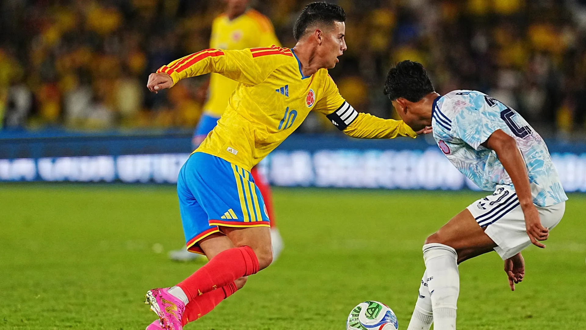 James Rodriguez of Colombia dribbles the ball against Alvaro Zamora of Costa Rica.