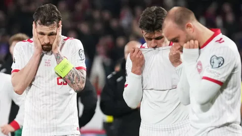 Pierre-Emile Hojbjerg of Denmark and his team look dejected.
