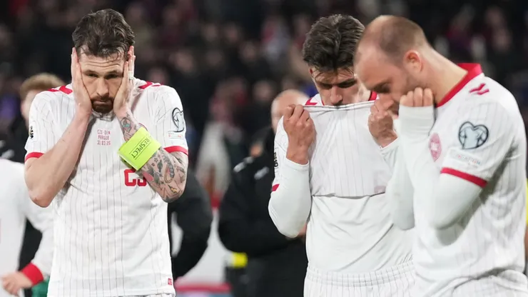 Pierre-Emile Hojbjerg of Denmark and his team look dejected.