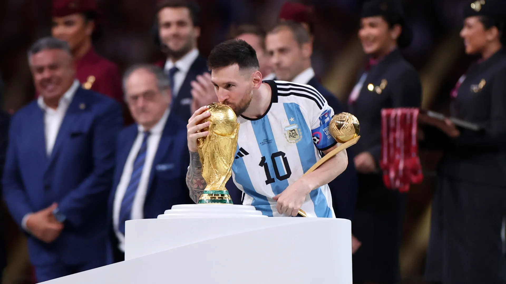 Lionel Messi of Argentina kisses the World Cup trophy. (Getty Images)