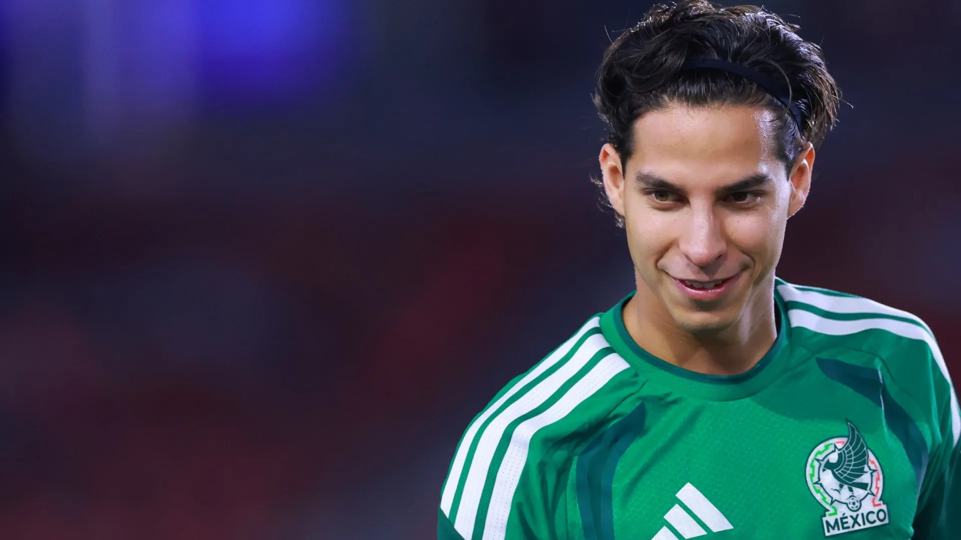 Diego Lainez of Mexico looks on.
