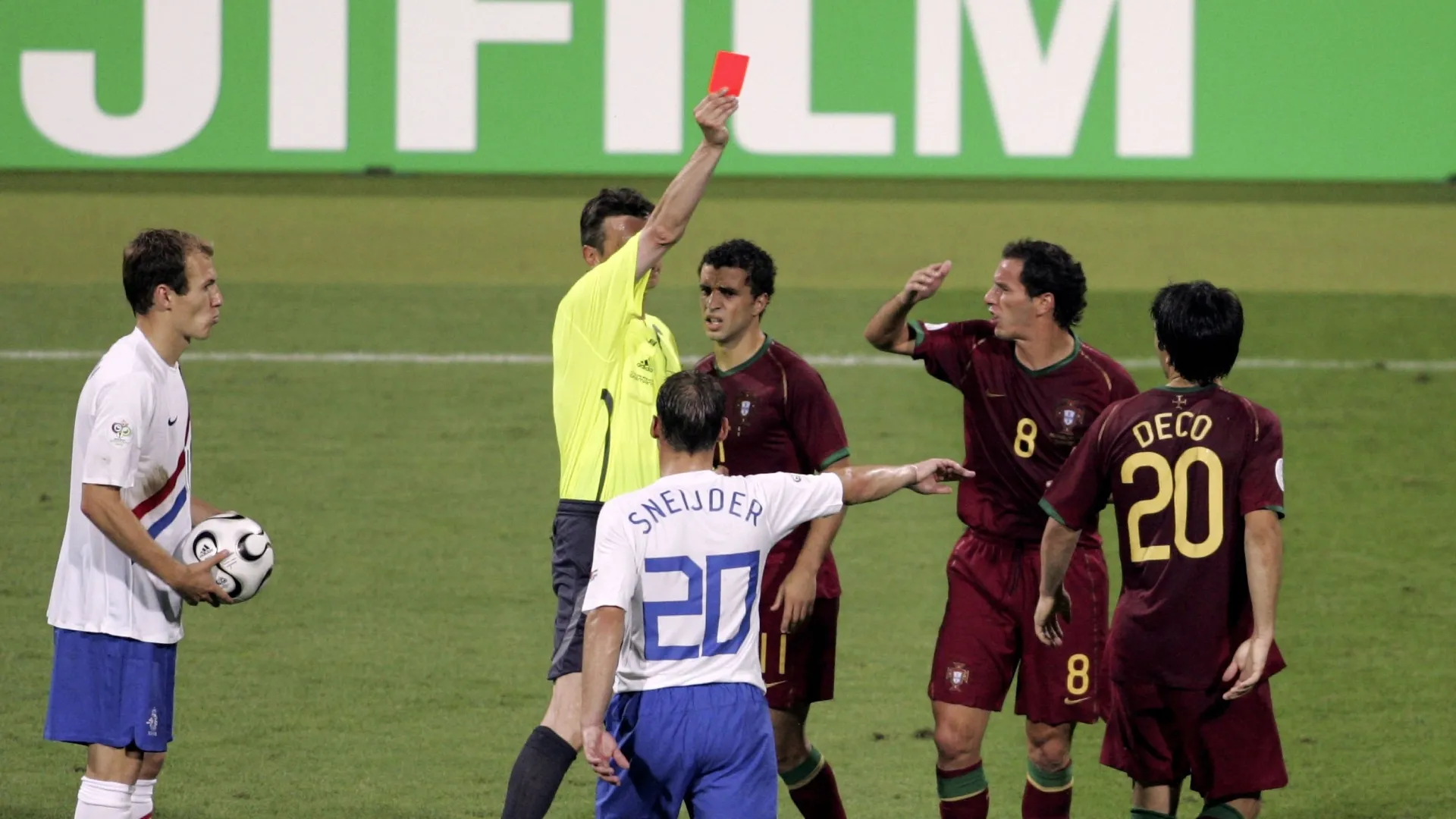 Deco #20 (R) of Portugal is shown the red card by Referee Valentin Ivanov of Russia.