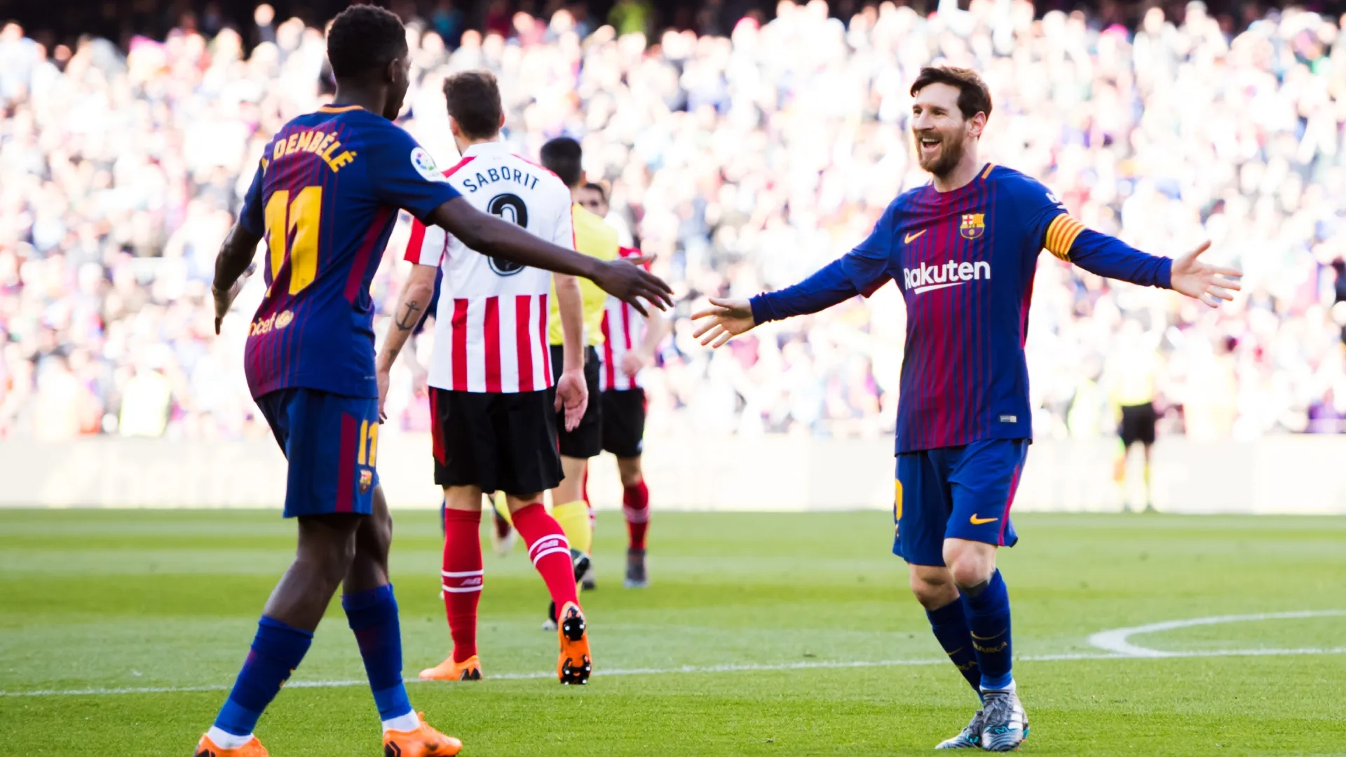 Dembele and Messi playing for Barcelona in 2018.