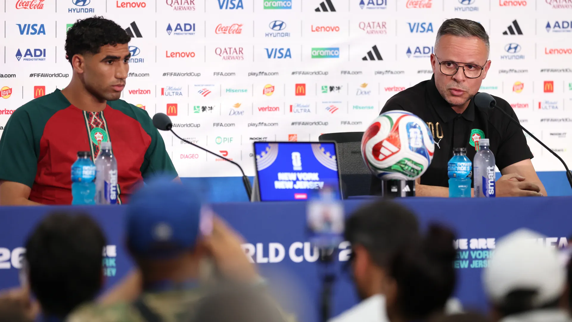 Morocco coach coach Mohamed Ouahbi (R) speaks to the media (Getty Images).