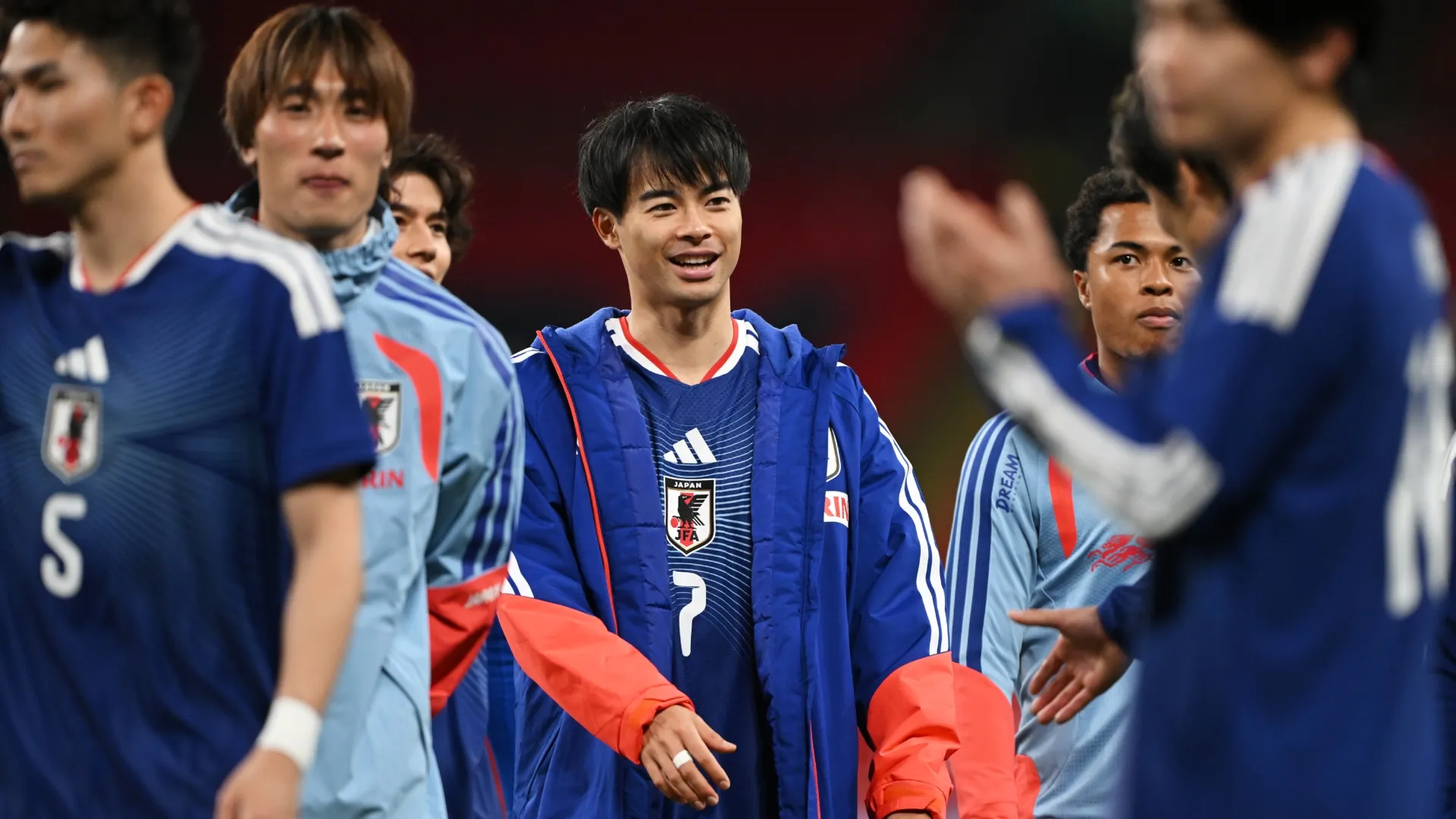 Kaoru Mitoma of Japan celebrates victory.