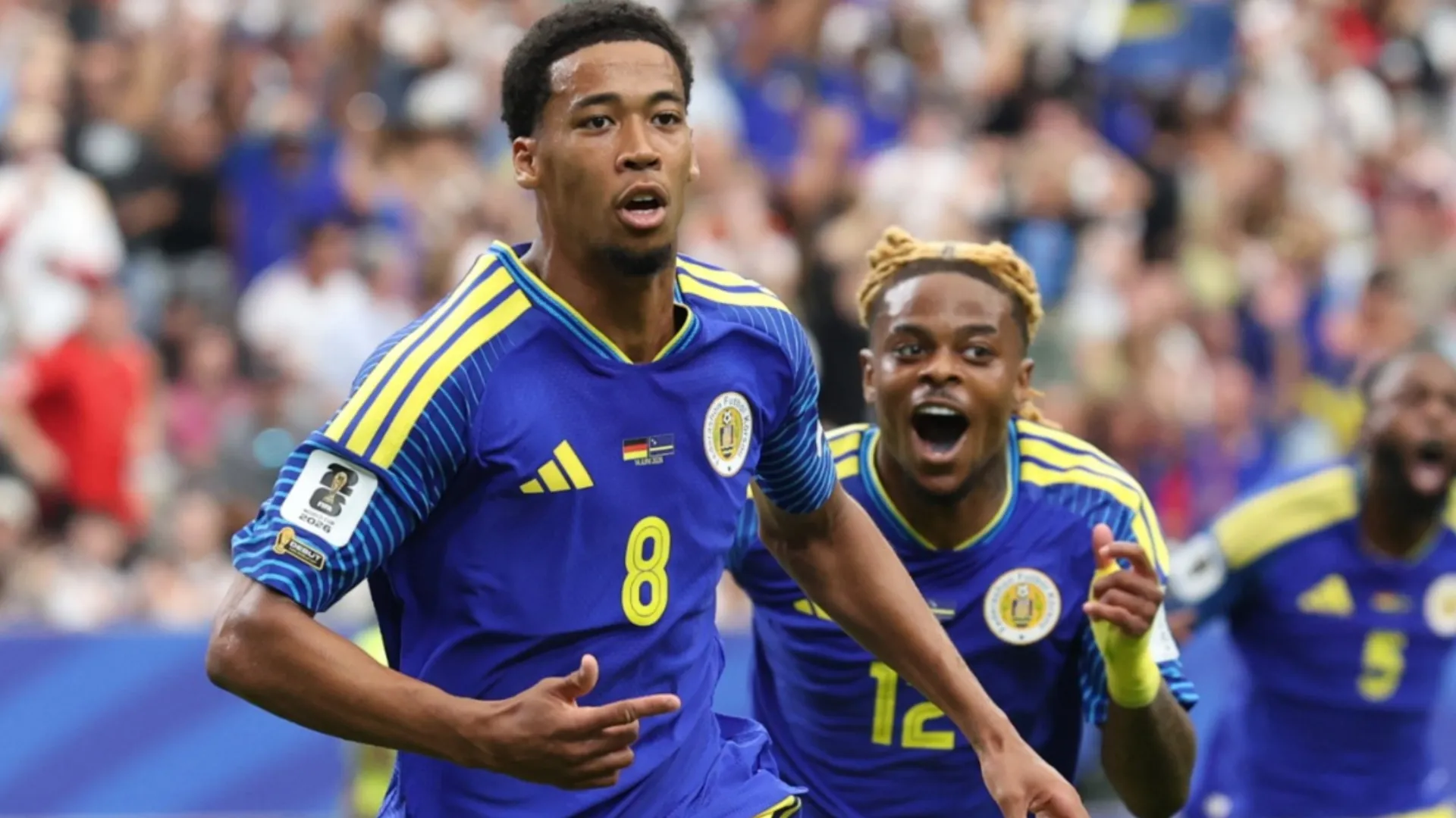Livano Comenencia #8 of Curacao celebrates scoring his team's first goal vs Germany.