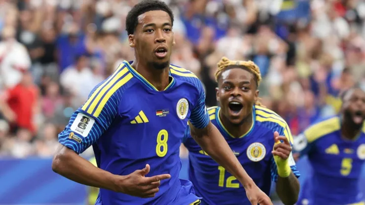 Livano Comenencia #8 of Curacao celebrates scoring his team's first goal vs Germany.