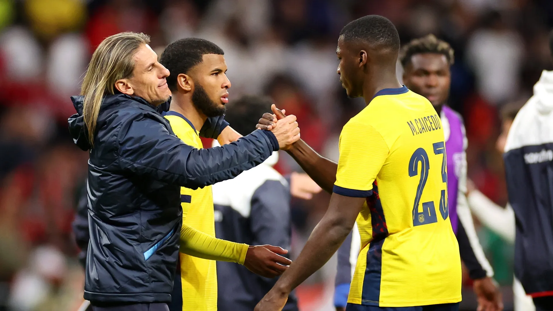Sebastian Beccacece, Head Coach of Ecuador interacts with Pedro Vite and Moises Caicedo of Ecuador.