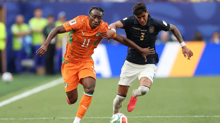 Yan Diomande #11 of Cote d'Ivoire controls the ball against Piero Hincapie #3 of Ecuador.