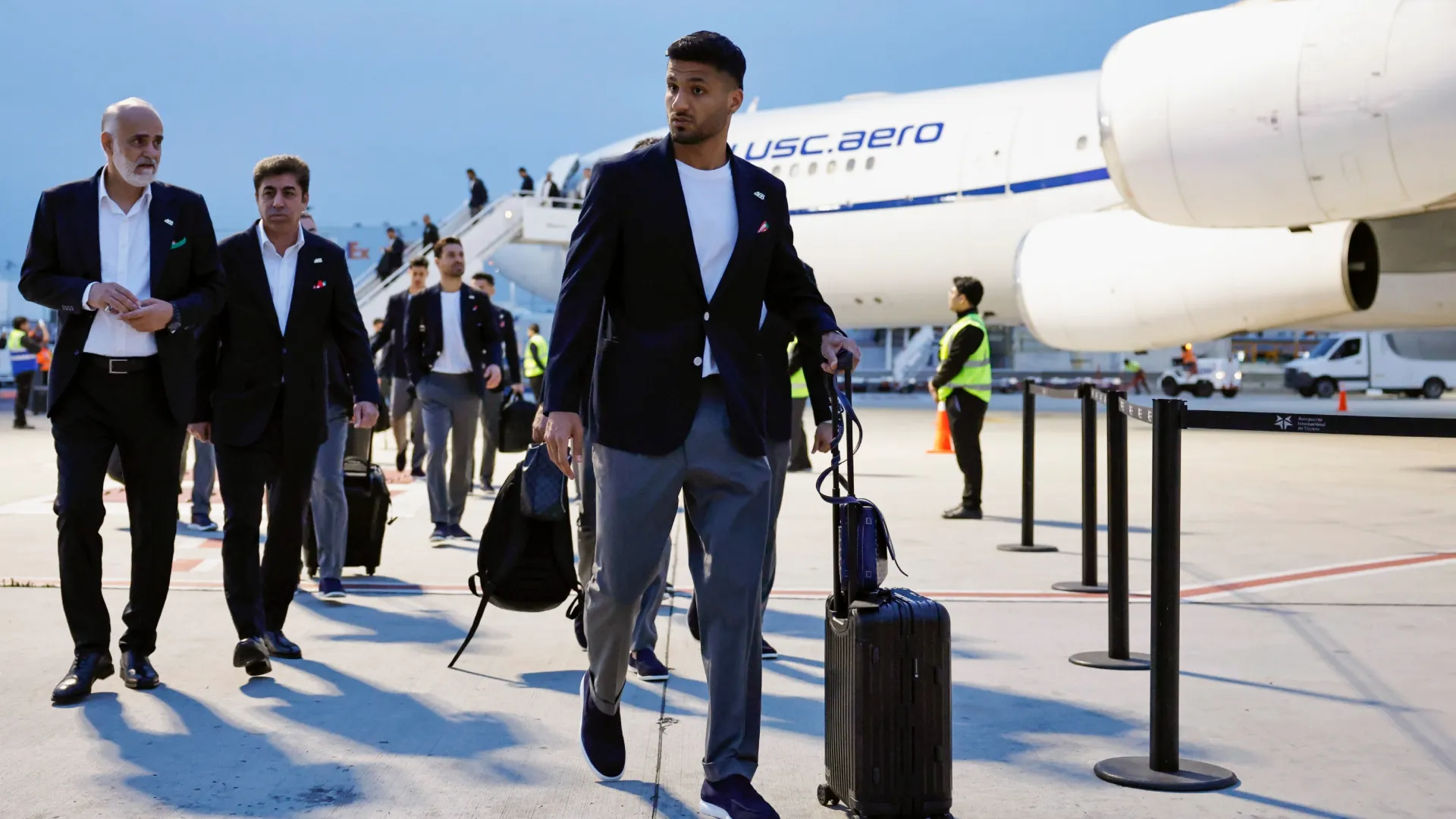 Members of the Iranian national soccer team arrive at Tijuana International Airport.