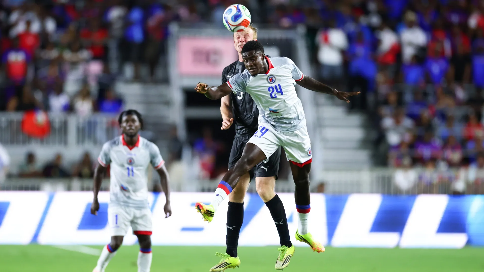Francis de Vries #3 of New Zealand and Wilguens Paugain #24 of Haiti compete for the ball.