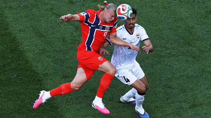 Erling Haaland #9 of Norway heads the ball against Zaid Tahseen #4 of Iraq.