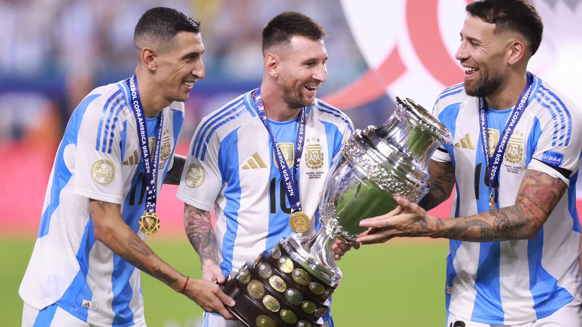 Angel Di Maria, Lionel Messi and Nicolas Otamendi of Argentina celebrate.
