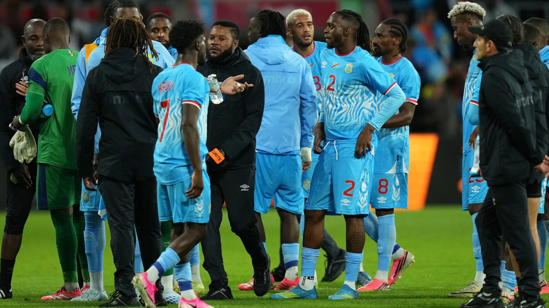 Aaron Wan-Bissaka of DR Congo interacts with teammates.
