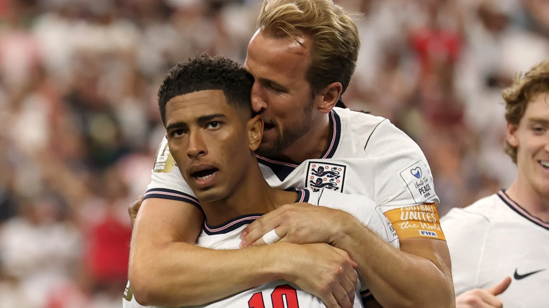 Jude Bellingham #10 of England celebrates with Harry Kane #9 after scoring a goal.