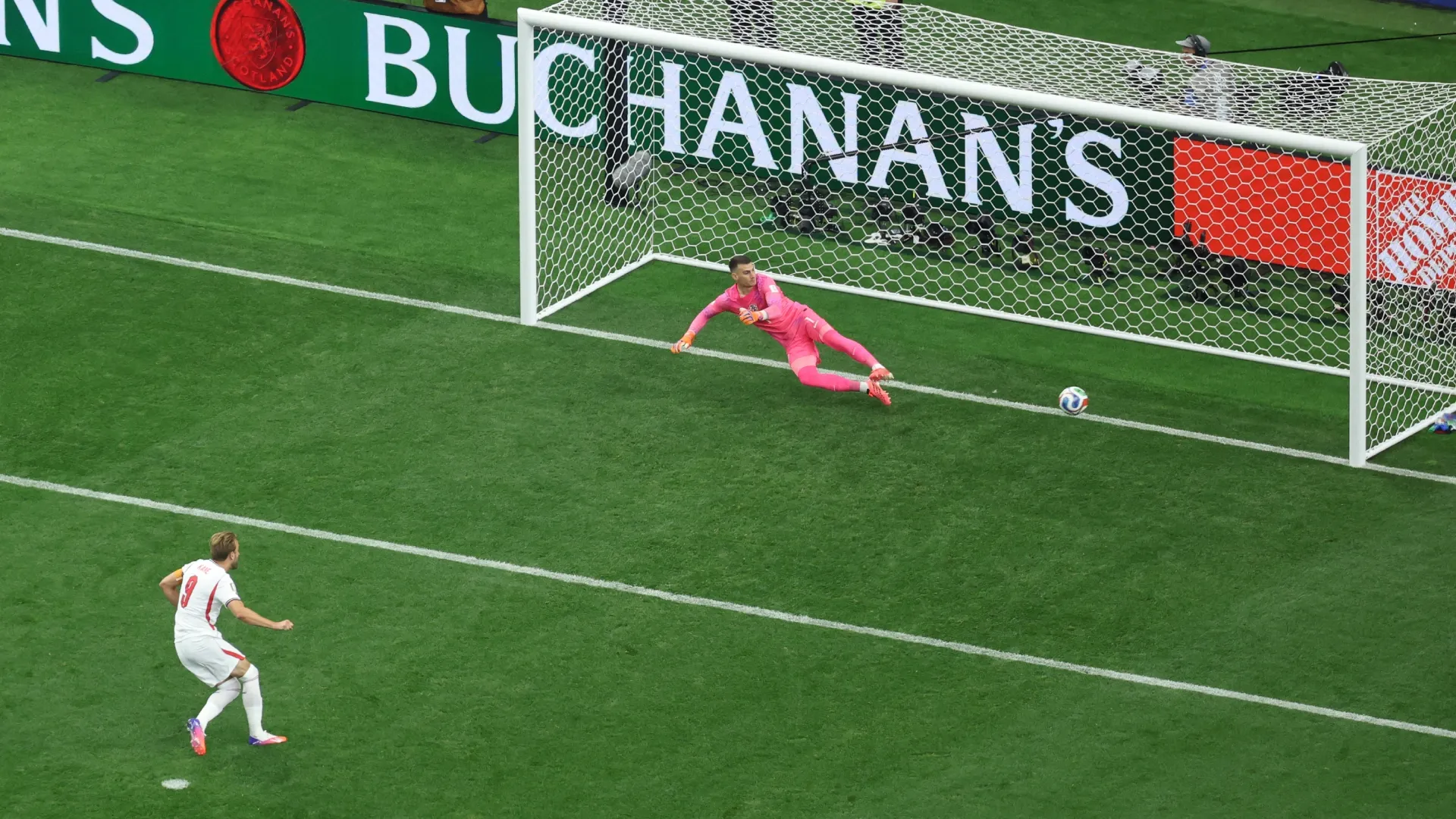 Harry Kane #9 of England scores a penalty against Croatia.
