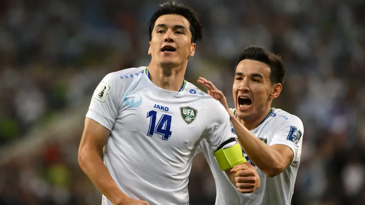 Eldor Shomurodov of Uzbekistan celebrates a goal.